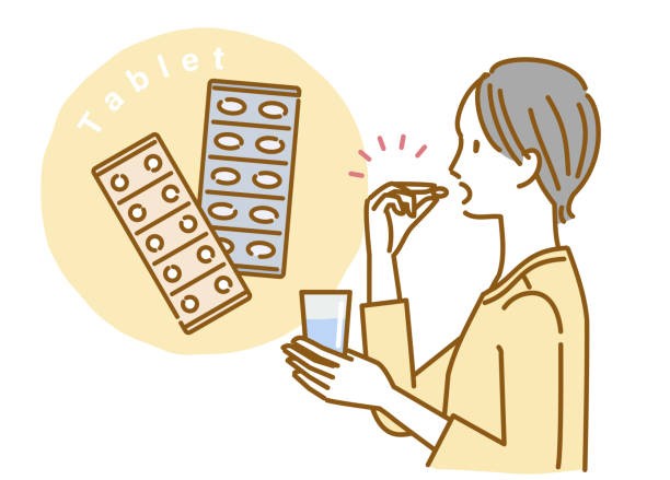 薬を飲む女性